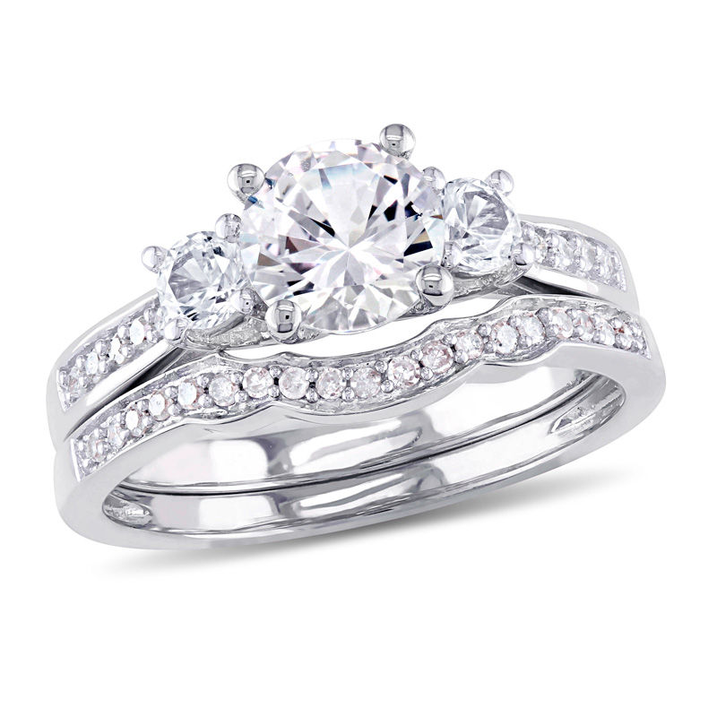 6.0mm White Sapphire and 1/8 CT. T.W. Diamond Three Stone Bridal Set in 10K White Gold